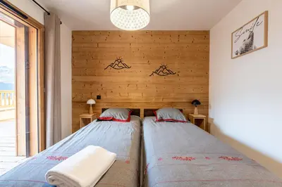 Un ou plusieurs lits dans un hébergement de l'établissement Les Cristaux Blancs - Station de ski à pied