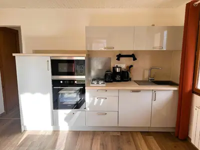 Cuisine ou kitchenette dans l'établissement Joli 2 pièces avec jardin près téléski, 4 pers. - FR-1-464-245