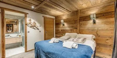 Un ou plusieurs lits dans un hébergement de l'établissement Chalet La Sachette - Chalets pour 14 Personnes MAE-1831