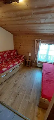 Un ou plusieurs lits dans un hébergement de l'établissement Chalet La Clavarine