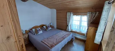 Un ou plusieurs lits dans un hébergement de l'établissement Chalet La Clavarine