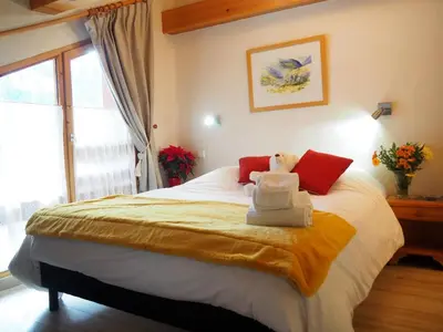 Un ou plusieurs lits dans un hébergement de l'établissement Chalet Les Barmés