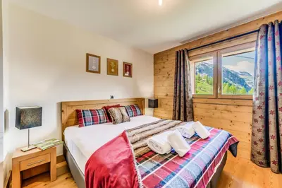Un ou plusieurs lits dans un hébergement de l'établissement Résidence Lodge Des Neiges C - Appartement 4 - pied de pistes, service hotelier inclus MAE-6751