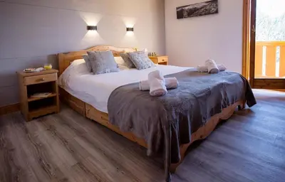 Un ou plusieurs lits dans un hébergement de l'établissement Chalet Marmotton-Domaine des Arcs