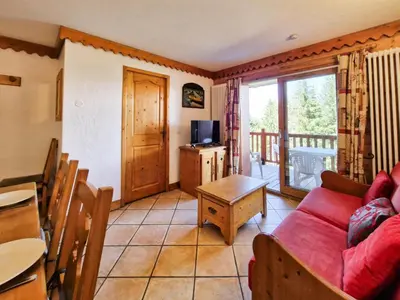 Télévision ou salle de divertissement dans l'établissement Résidence Roselend - Charmant appartement de 3 pièces situé dans une résidence au village du Chantel, proche des pistes et avec piscine. MAE-4441