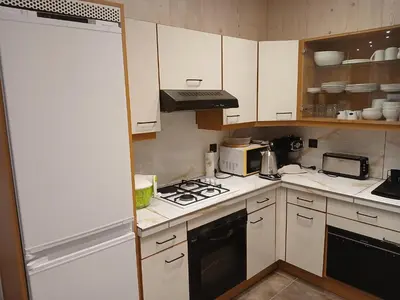 Cuisine ou kitchenette dans l'établissement chez Léon
