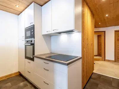 Cuisine ou kitchenette dans l'établissement Apartment Les Hauts du Val Claret - Val Claret-27 by Interhome