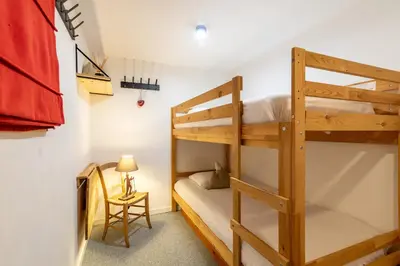 Un ou plusieurs lits dans un hébergement de l'établissement Le chalet de Lili 2 pièces duplex, skis aux pieds, balcon