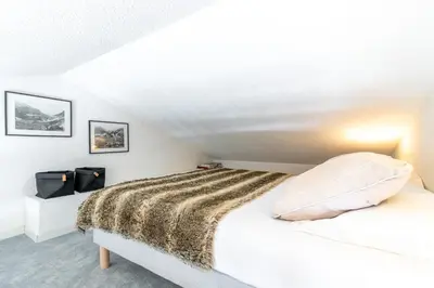 Un ou plusieurs lits dans un hébergement de l'établissement Le chalet de Lili 2 pièces duplex, skis aux pieds, balcon