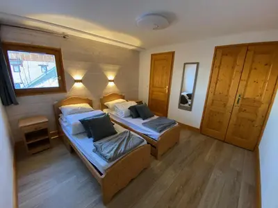 Un ou plusieurs lits dans un hébergement de l'établissement Chalet Chamois Domaine des Arcs sauna