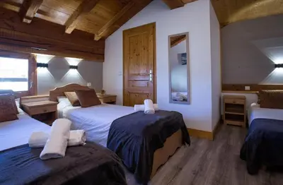 Un ou plusieurs lits dans un hébergement de l'établissement Chalet Bouquetin-Paradiski-12 pers