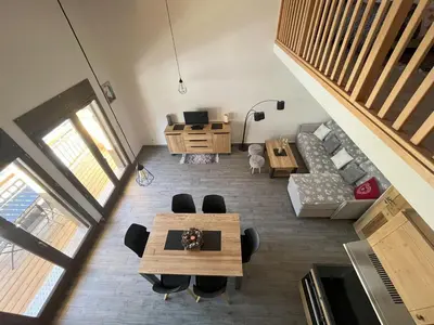 Coin salon dans l'établissement Confort moderne avec mezzanine près du téléphérique - FR-1-464-247