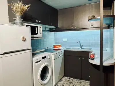 Cuisine ou kitchenette dans l'établissement Les Marmottes by valcenis net