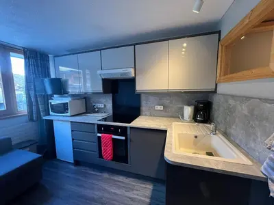 Cuisine ou kitchenette dans l'établissement Charmant studio - pied des pistes
