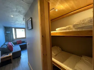 Un ou plusieurs lits dans un hébergement de l'établissement Charmant studio - pied des pistes