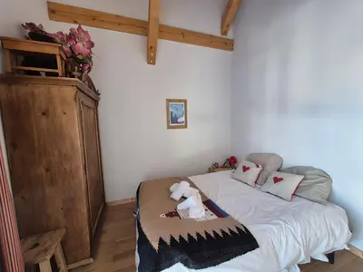 Un ou plusieurs lits dans un hébergement de l'établissement Chalet Cent Names - 8 pers - St Foy Station