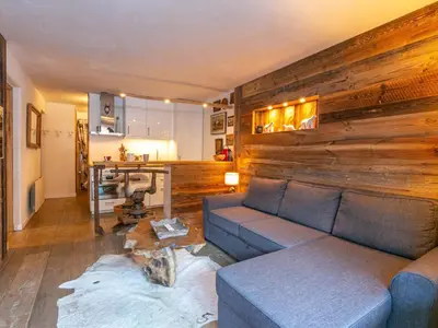 Coin salon dans l'établissement Charmant appartement cosy au cœur de Val-d'Isère - FR-1-694-377