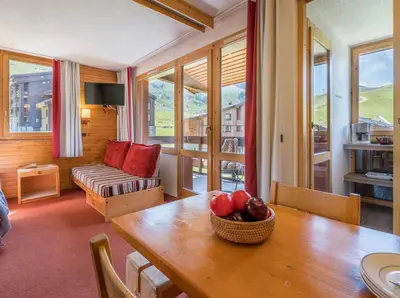 Coin salon dans l'établissement Les Terrasses Blanches - Appartement Belle Plagne - 4 personnes - Exposition plein Sud - Sur pistes