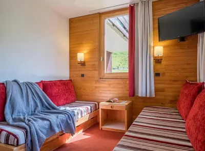 Coin salon dans l'établissement Les Terrasses Blanches - Appartement Belle Plagne - 4 personnes - Exposition plein Sud - Sur pistes