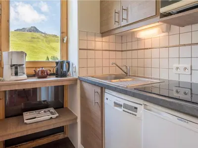 Cuisine ou kitchenette dans l'établissement Les Terrasses Blanches - Appartement Belle Plagne - 4 personnes - Exposition plein Sud - Sur pistes