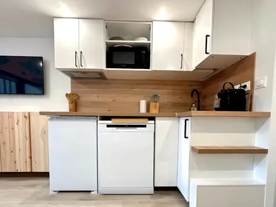 Cuisine ou kitchenette dans l'établissement l'Ourson appartement central champagny la plagne