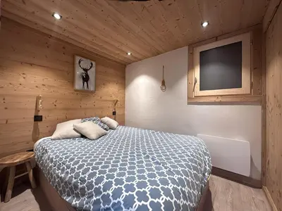 Un ou plusieurs lits dans un hébergement de l'établissement L’Éterlou Au pied des pistes, vue montagne