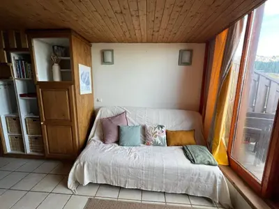 Un ou plusieurs lits dans un hébergement de l'établissement Duplex skis aux pieds pour 6 à Arc 1800 avec balcon - FR-1-411-951