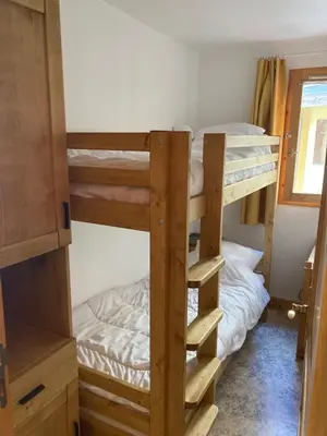 Un ou plusieurs lits dans un hébergement de l'établissement Appartement 2 étoiles en pied de pistes et au centre ville 4 personnes