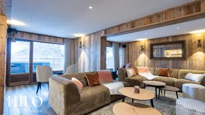 Coin salon dans l'établissement Suite Gelinotte 401 Val d'Isère by HILO Collection - 12 people - Jacuzzi