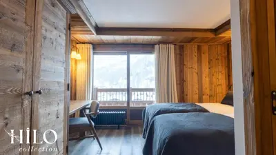 Un ou plusieurs lits dans un hébergement de l'établissement Suite Gelinotte 401 Val d'Isère by HILO Collection - 12 people - Jacuzzi