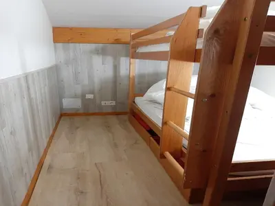 Un ou plusieurs lits dans un hébergement de l'établissement Apartment for 8 people with parking