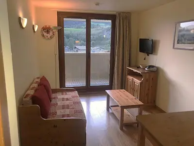 Télévision ou salle de divertissement dans l'établissement Apartment in Val Cenis near Arc River