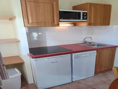 Cuisine ou kitchenette dans l'établissement Apartment near Télésiège Girarde