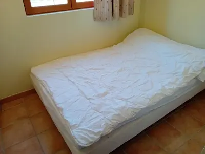 Un ou plusieurs lits dans un hébergement de l'établissement Apartment for 6 people with 2 rooms
