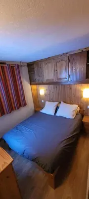 Un ou plusieurs lits dans un hébergement de l'établissement Chalet LA MOURRA