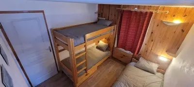 Un ou plusieurs lits dans un hébergement de l'établissement Chalet LA MOURRA