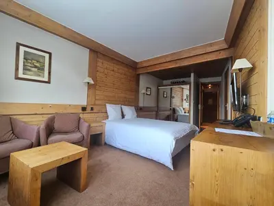 Un ou plusieurs lits dans un hébergement de l'établissement Hotel Le Ski D'or