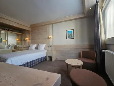 Un ou plusieurs lits dans un hébergement de l'établissement Hotel Le Ski D'or