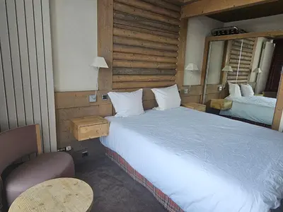 Un ou plusieurs lits dans un hébergement de l'établissement Hotel Le Ski D'or