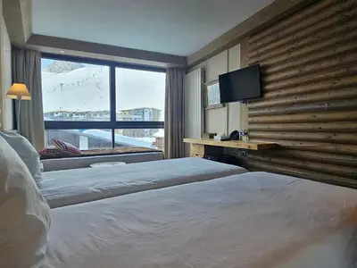 Un ou plusieurs lits dans un hébergement de l'établissement Hotel Le Ski D'or