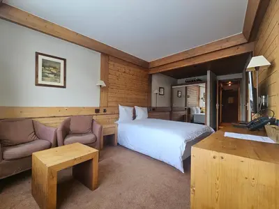 Un ou plusieurs lits dans un hébergement de l'établissement Hotel Le Ski D'or