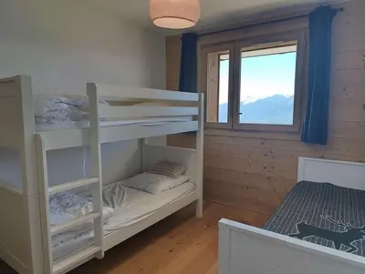 Un ou plusieurs lits dans un hébergement de l'établissement Paradiski nouveau, calme et ensoleillé vallandry