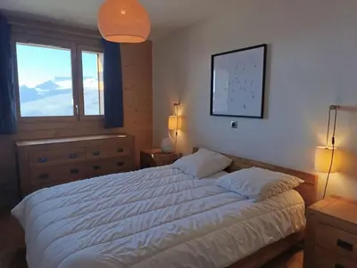 Un ou plusieurs lits dans un hébergement de l'établissement Paradiski nouveau, calme et ensoleillé vallandry