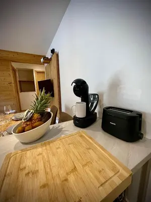 Cuisine ou kitchenette dans l'établissement L'Ampoua