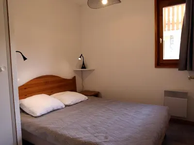 Un ou plusieurs lits dans un hébergement de l'établissement Appartement confortable à Aussois pour 6 avec terrasse - FR-1-508B-1