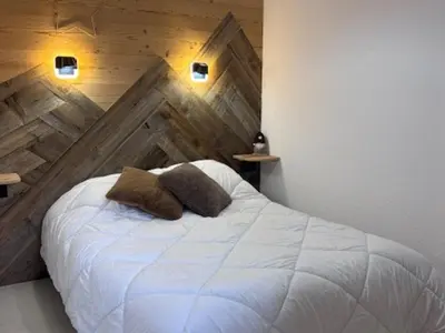 Un ou plusieurs lits dans un hébergement de l'établissement Appartement calme proche navettes, proche piscine - FR-1-508B-50