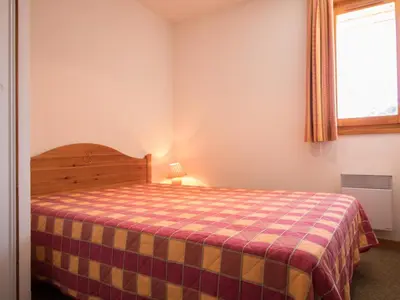 Un ou plusieurs lits dans un hébergement de l'établissement Appartement pour 6 à Aussois, balcon et wifi à la réception - FR-1-508B-2