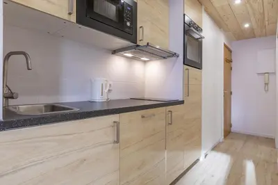 Cuisine ou kitchenette dans l'établissement Résidence Le Val d'Illaz - Val-d'Isère