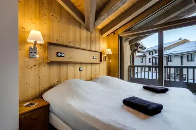 Un ou plusieurs lits dans un hébergement de l'établissement Chalet La Mourra