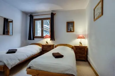 Un ou plusieurs lits dans un hébergement de l'établissement Chalet La Mourra